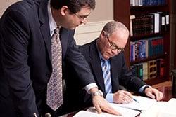 Social Security Disability Attorney Lewis and Gabriel examine a case together.