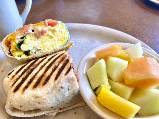 Spring breakfast sandwich. Scrambled eggs, spinach, avocado, tomatoes, and salsa, in a pressed wrap