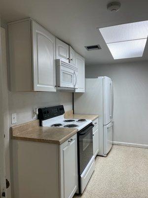 Kitchen with Stove, Microwave and Fridge