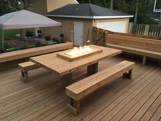 This a custom deck, table and outdoor firepit that we fabricated