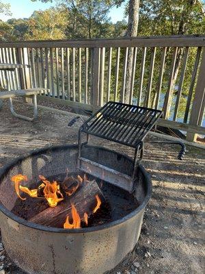 Fire pit on lakefront deck at our campsite.