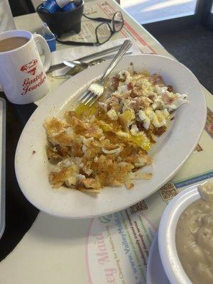 Closer view of the eggs, hash and hash browns