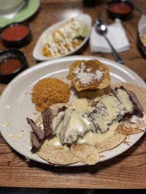 Huevos michaocano (sp? ). Eggs, tortillas and beef.