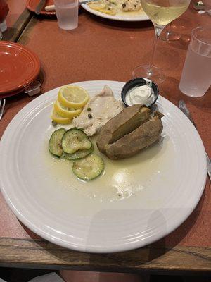 Chicken piccata with zucchini and baked potato.