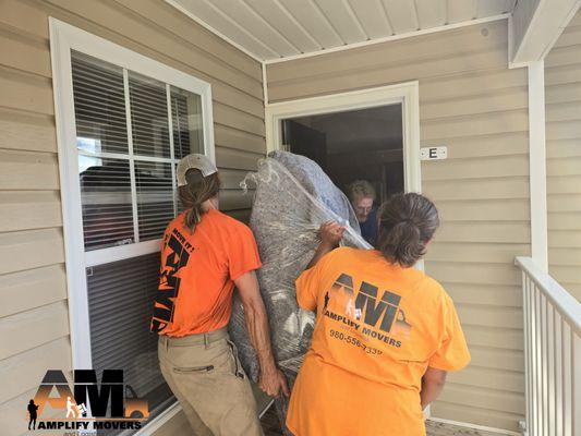 Moving in a couch in a 2nd floor apartment for a customer.  The couch is stretch wrap to prevent any tear or wear.