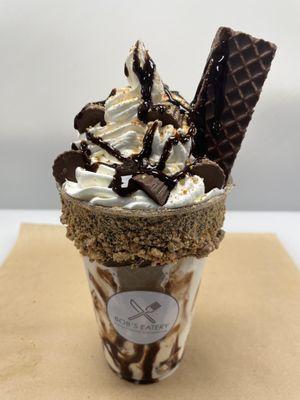 Peanut Butter Dream Specialty Shake: Peanut Butter base dressed with Chocolate-Peanut Butter Bar, a Brownie, & Peanut Butter Cups