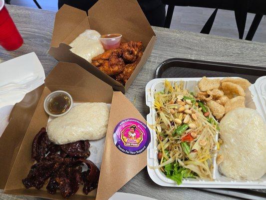 Lower left - beef jerky (mild), right lower - Papaya salad, top left - chicken wings with chili sauce