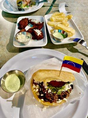 Pabellón arepa, yuca fries, and plantains.