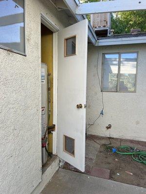 Brand new water heater door installed.