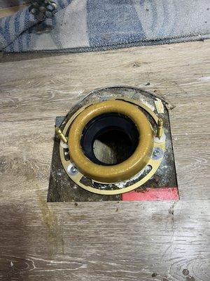 Replaced with new toilet flange, wax ring, and new bolts