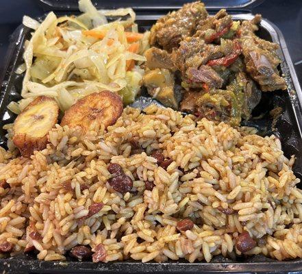 Curried goat, rice & peas, cabbage and plantains