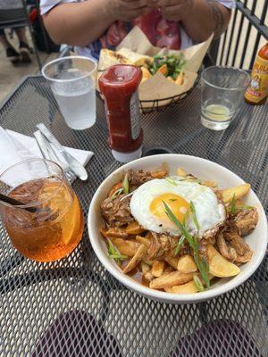 Poutine and aperol spritz