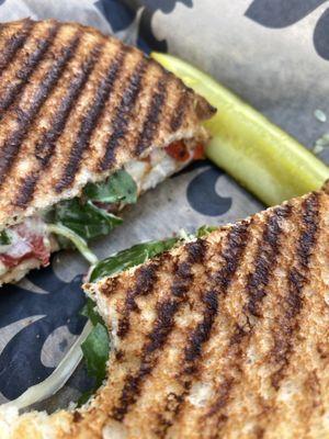 Chicken panini with a bite out of it. Surprised I paused for the photo, it was that good!!!