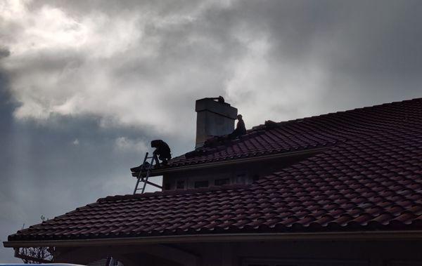 RoofTek crew working around the chimney