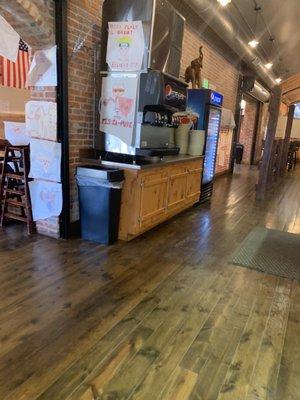 Self serve fountain drinks.  Original brick walls and hardwood floors.