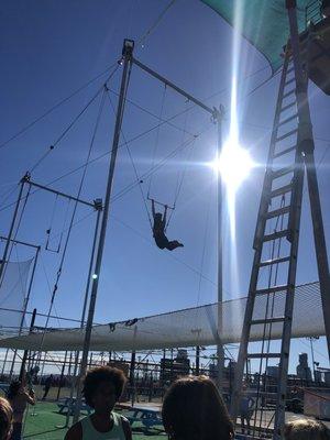 A student on the trapeze in a good banana form