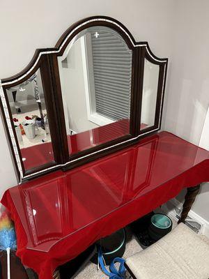 A vanity with a table top and mirrors cut to fit installed by Martin's Glass&Mirror Inc.