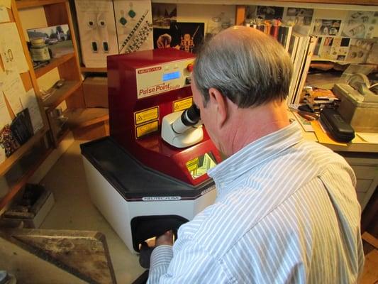 Russell working with the laser welder.