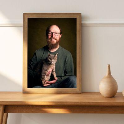 Framed portrait, man and his cat.