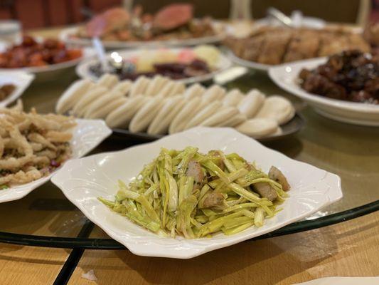 Peaking duck , steamed buns, yellow chives with fish cakes, two steamed crab, etc