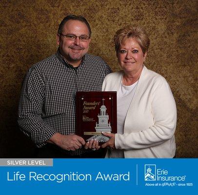 Meeks Insurance, located in Vincennes, Indiana, accepts the Silver Life Recognition Award from Erie Insurance. (812) 886-4000.