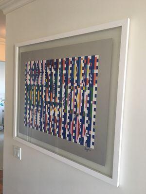 Original AGAM artwork we framed using double sided glass floating