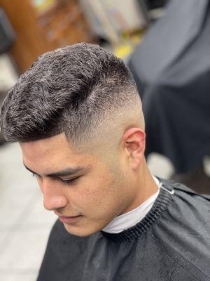 Mid high skin fade , with line up