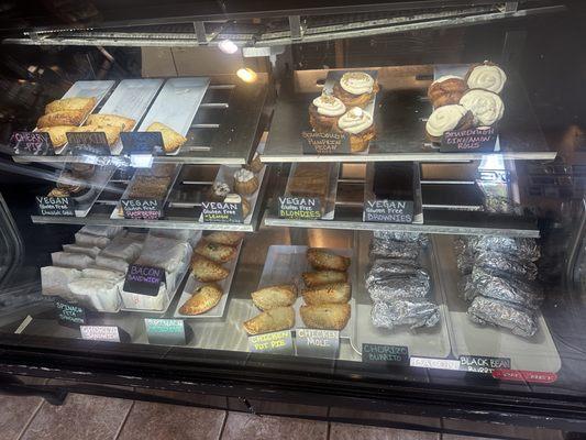 Glass case of pastries and hot food