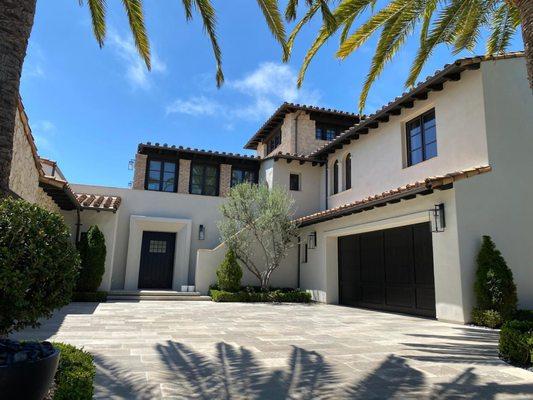 Freshly painted body and stained doors and windows on the exterior of this residence is sharp and clean.