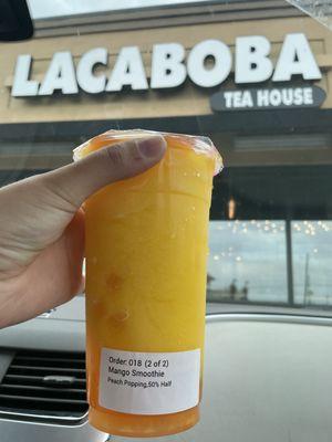 Mango smoothie with peach pop boba 50% sweetness level