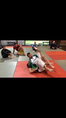 Coach Brad teaching leg locks in one of our many classes!