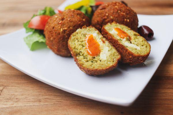 Stuffed falafel with a drizzle of harissa.