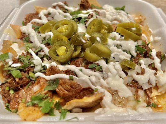 Birria Nachos. Similar to the Birria Quesadilla, but with warm tortilla chips, crema, and jalapeños added. Great meal on its own.