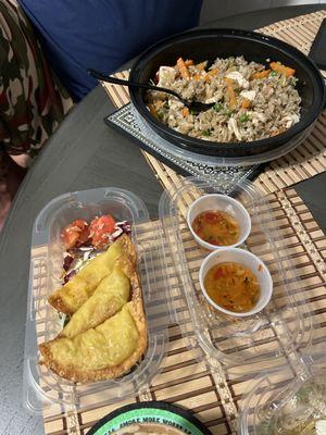 Pineapple fried rice with Chicken. And chicken curry dumplings