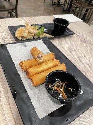 Pan fried dumpling (background)
 Minced Pork Eggroll 
 (foreground)