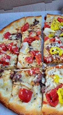 A Sicilian pizza with steak