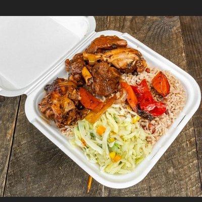 Brown stew chicken rice and peas with steam cabbage