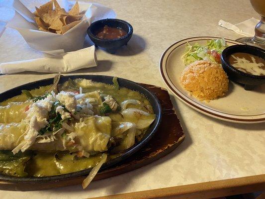 Chicken enchiladas, rice, beans, salad