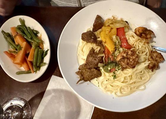 Cajun shrimp and filet-mignon tips on linguini