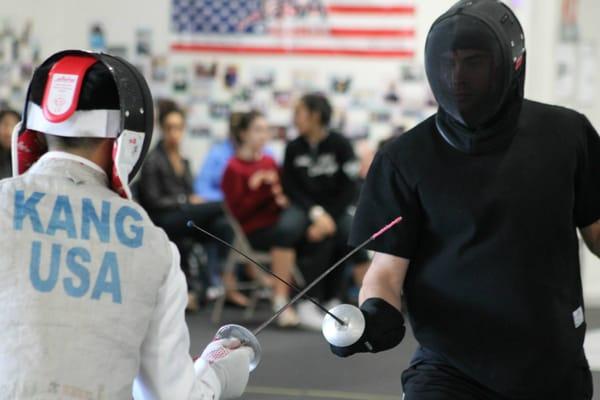 Coach MacDougall giving a private lesson to one of his high level students.