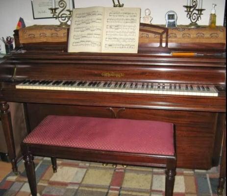 The beautiful 1950 Chickering console piano in my studio; solid mahogany with real ebony and ivory keys.