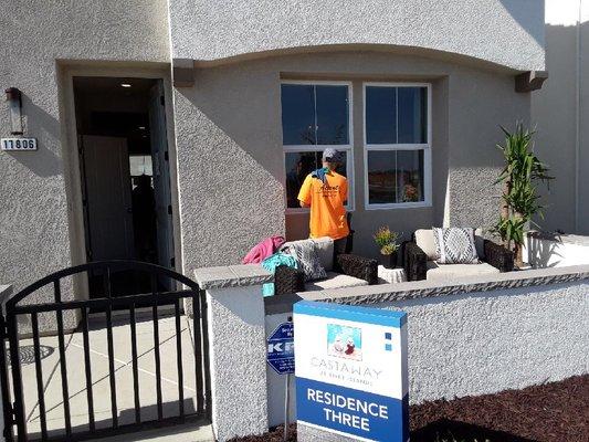 One of our model employees John Mitchell, cleaning the windows of a newly built model home.