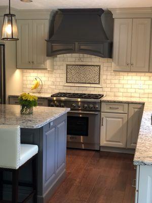 Two tone kitchen. Off white paired with dark grey. Granite countertops