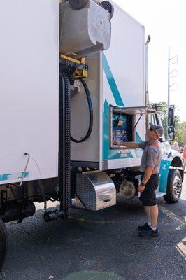 Rock Solid Shredding employee operating shred truck