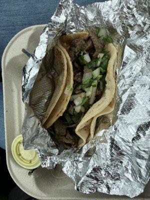 Carne Asada taco and green salsa.