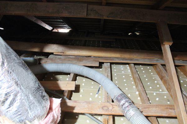 Old roof insulation removal and attic clean-up.