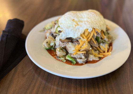 Duck Hash:  Duck confit, potatoes, brussel sprouts, mushrooms, red chile, cheese and eggs your way. Oh my.