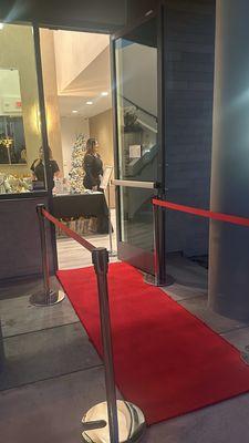 Red carpet entrance for the holiday party 11.20.24