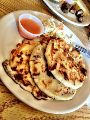 Pupusas filled with cheese and frijoles. Delicious!