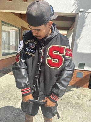 My son with his lettermen jacket custom made from Rev Varsity!